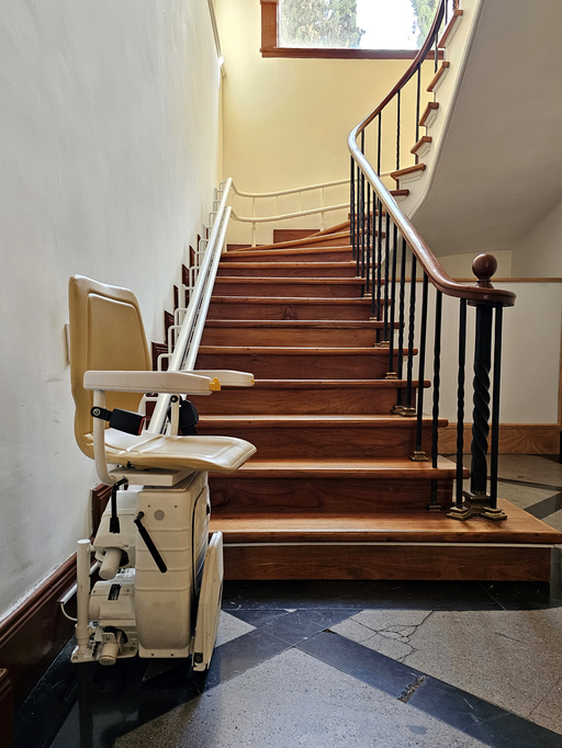 a stairlift for going up and down stairs an elevator system intended for elderly people or people with mobility problems, using a guide, it allows us to move through a mechanized chair